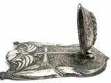 a silver plate with a picture of a lion on it