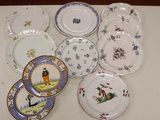 many plates with different designs on them on a table