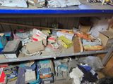 a shelf full of assorted items in a cluttered room