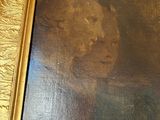a painting of a man and a woman in a gold frame