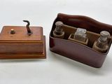 a small wooden box with bottles in it on a table