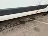 a white van that is parked in a parking lot