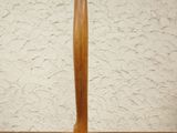 a wooden sculpture of a surfboard on a wooden table