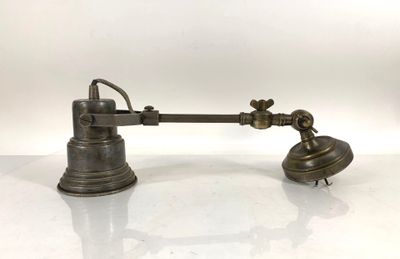 an antique brass desk lamp on a white surface