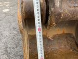 a measuring tape on the back of a bulldozer