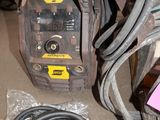 a pile of assorted electrical equipment in a room