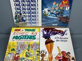three books on a table, one of which is a cartoon character and the other of which is a cartoon