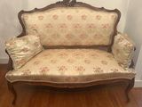 a couch that is sitting on a hard wood floor