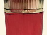 an image of a red glass jar with a gold lid