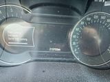 a close up of a speedometer on a car ' s dashboard
