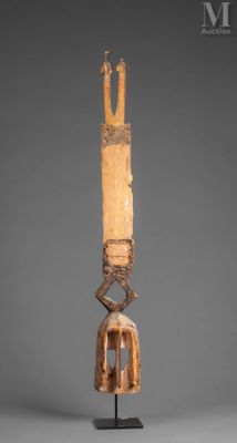 a wooden sculpture of a man with a crown on his head