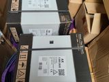 several boxes are stacked on top of each other in a room