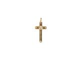 un pendentif en forme de croix en or orné d'un diamant