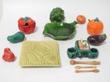 many different types of figurines displayed on the table