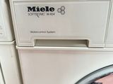 a washing machine that is sitting on top of a washing machine