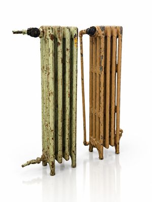 two old radiators sitting next to each other on a white surface