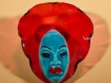 a red and blue mask with a blue face on it