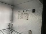 a picture of the inside of a freezer with the door open