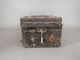 an old metal box with a tag on it