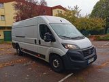 a silver van that is parked in a parking lot