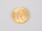 an image of a gold coin with the image of a woman on it