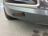 a close up of a car ' s bumper with a sticker on it