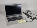 a laptop computer that is sitting on a table