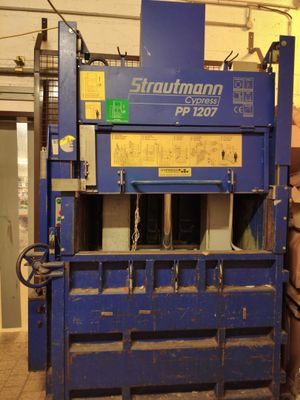 a large blue machine that is sitting in a warehouse