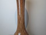 a vase that is sitting on a glass stand