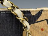 an image of a close up of a purse with a chain
