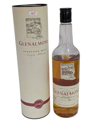 a bottle of glenalmon whisky next to a cardboard box