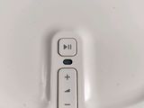 a close up of a remote control on a white plate