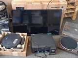 a lot of electronics that are sitting on the floor