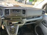 a dashboard of a car with a steering wheel and dashboard controls