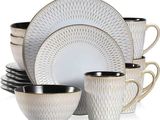 a stack of cups and saucers sitting on a white table