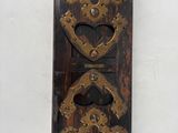 a wall mounted clock that has a heart on it