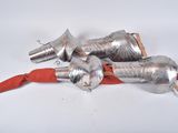 four silver metal objects on a red umbrella