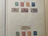 an open book with a picture of stamps on the pages