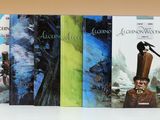 quatre livres posés sur une table