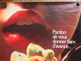 a poster of a woman eating pasta with a fork