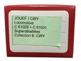red and white business card holder with a green sticker on it