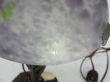 a close up of a lamp on a table