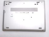 a close up of a laptop with a small battery on it