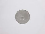 a picture of a silver disk on a white surface