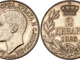 a silver coin with a crown on top of it