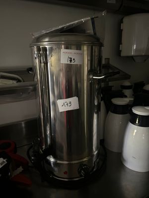 a stainless steel coffee pot sitting on a kitchen counter