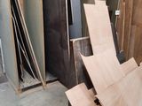 several pieces of wood are stacked on top of each other in a room