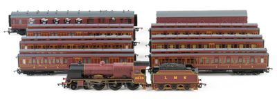 two trains sitting next to each other on a white surface
