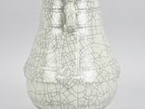 a white vase with a cracky design on it