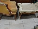 two chairs and a foot stool in a room